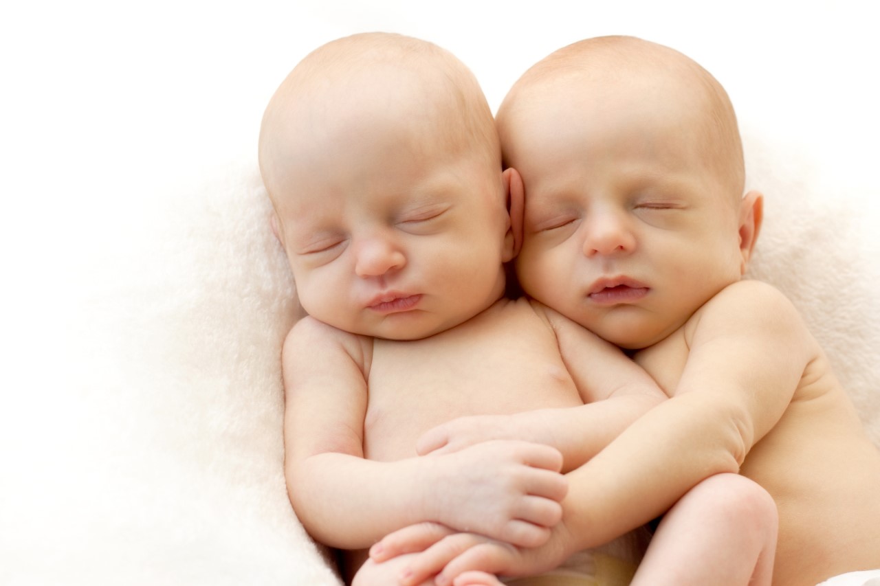 two babies hugging